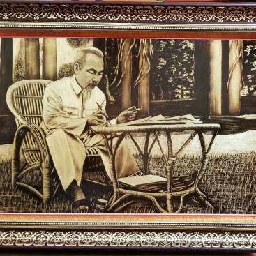 tranh-bac-ho-ngoi-ghe-may